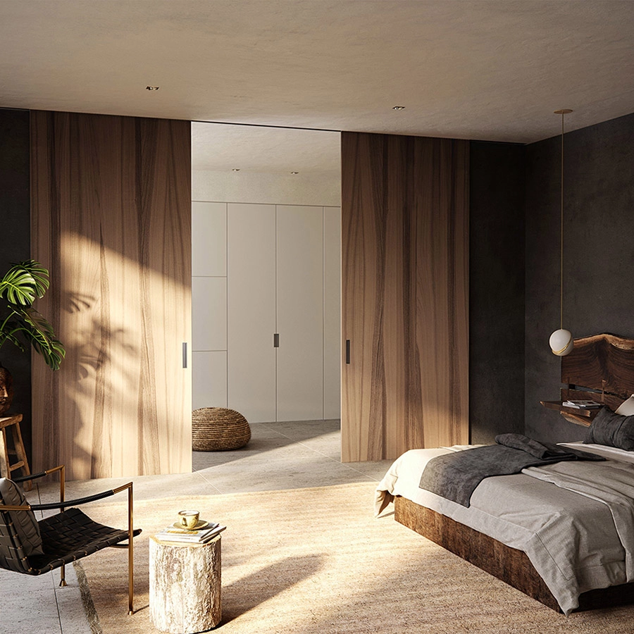 Puerta corredera de interior en madera que separa dormitorio y vestidor de Ferrero Legno