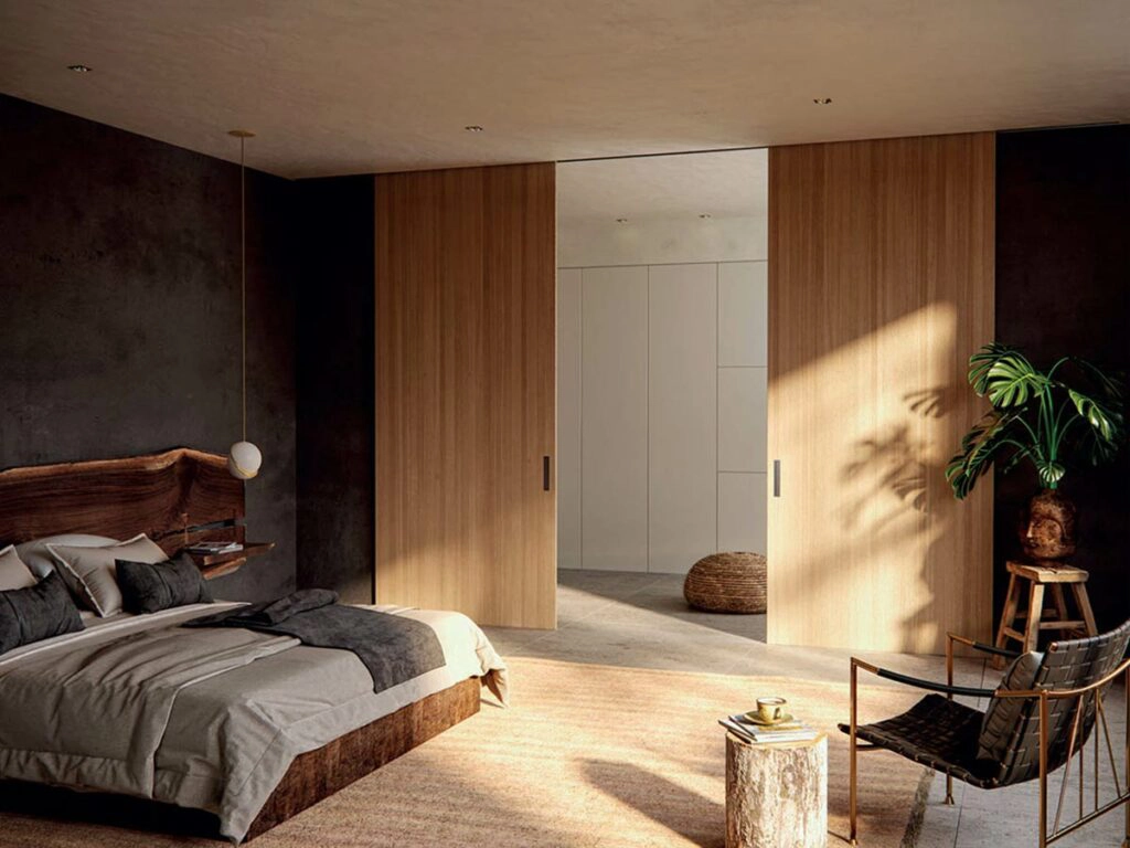 Vista de habitación con puertas interiores correderas amplias de madera.
